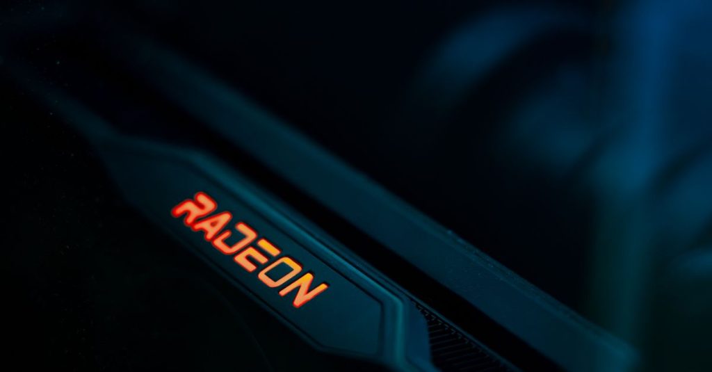 Detailed view of a glowing Radeon graphics card highlighting its hardware design.