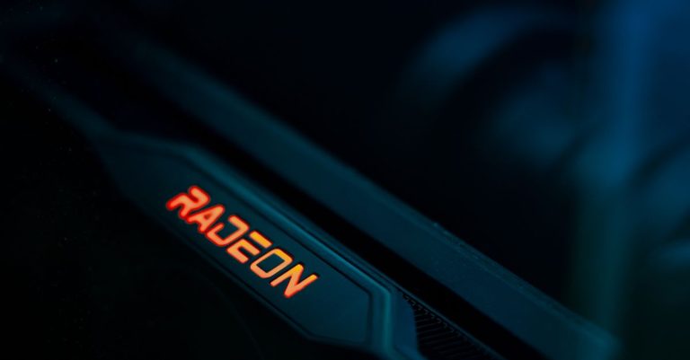 Detailed view of a glowing Radeon graphics card highlighting its hardware design.