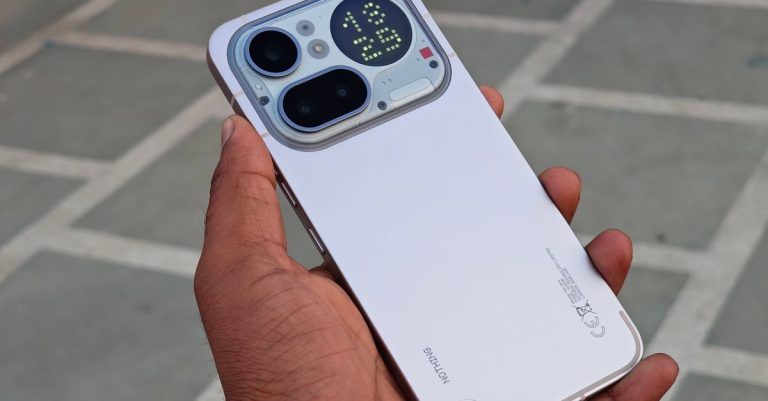 Close-up of a modern smartphone showcasing rear display and camera features.