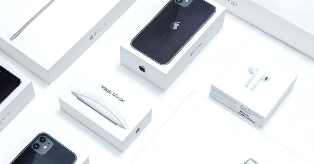 Flat lay of assorted Apple product boxes showcasing technology packaging design.
