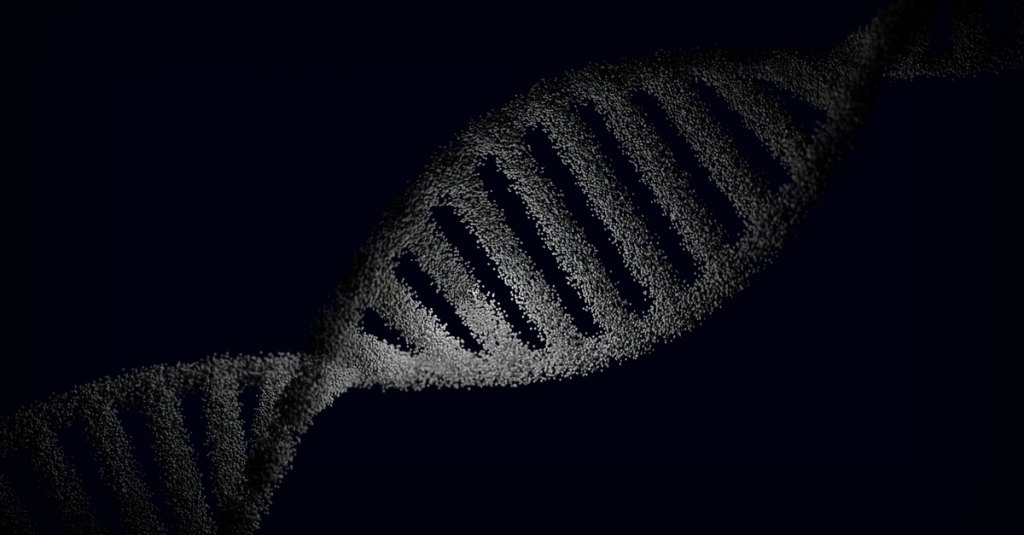 Artistic rendering of a DNA strand with particle effects against a dark background.