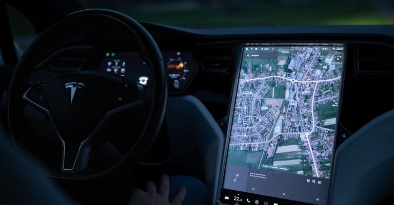 Explore the advanced touchscreen navigation in a modern electric vehicle's sleek interior at night.