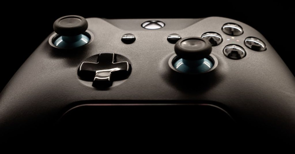 A detailed close-up of a modern gaming controller highlighting its design and functionality.